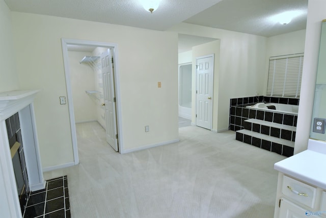 interior space with a closet and a textured ceiling