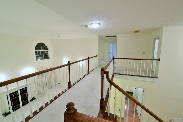 corridor featuring a textured ceiling