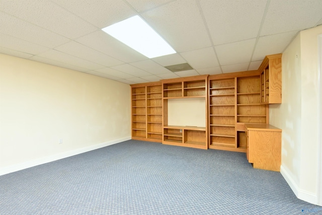 interior space with carpet flooring and a drop ceiling