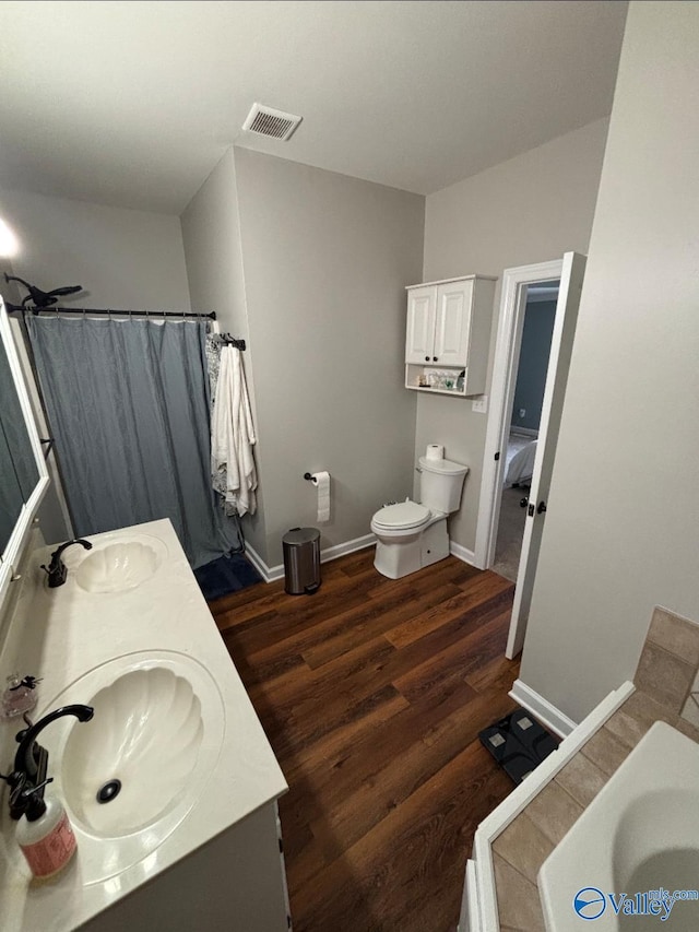 103 Covey Ln, Hazel Green, AL 35750 - full bathroom with double vanity, wood finished floors, a tub to relax in, and curtained shower