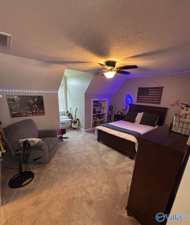 103 Covey Ln, Hazel Green, AL 35750 - carpeted bedroom featuring a textured ceiling, vaulted ceiling, and a ceiling fan