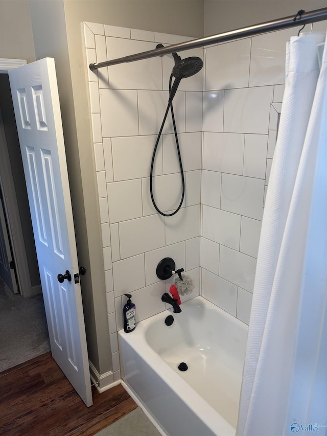103 Covey Ln, Hazel Green, AL 35750 - bathroom featuring shower / bathtub combination with curtain and wood finished floors