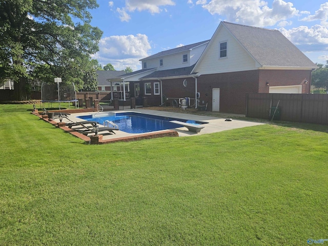 103 Covey Ln, Hazel Green, AL 35750 - view of swimming pool featuring a trampoline, a fenced backyard, a diving board, and a patio