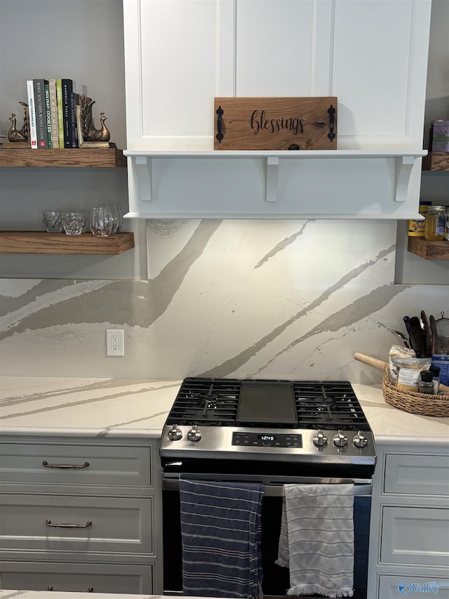 103 Covey Ln, Hazel Green, AL 35750 - kitchen featuring stainless steel gas range oven, open shelves, light stone countertops, and white cabinetry