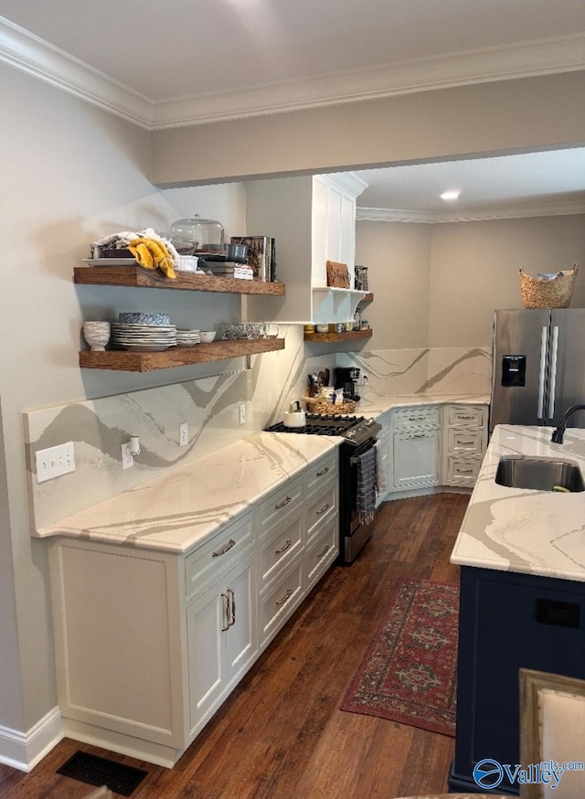 103 Covey Ln, Hazel Green, AL 35750 - kitchen with stainless steel appliances, open shelves, dark wood-type flooring, light stone countertops, and ornamental molding