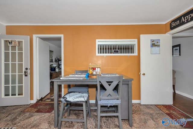 dining room featuring ornamental molding