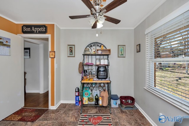 interior space with ceiling fan, ornamental molding, and plenty of natural light