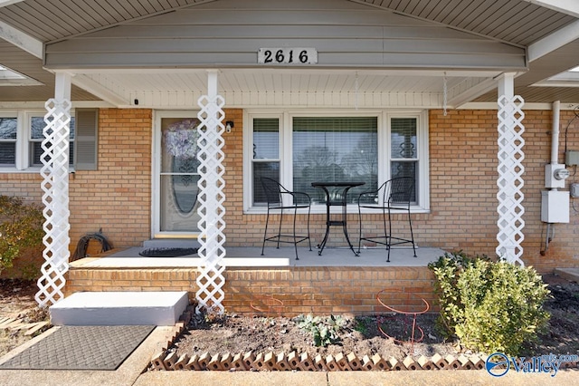 property entrance featuring covered porch