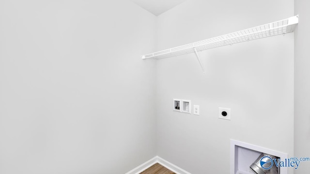 laundry area with hookup for an electric dryer, washer hookup, and hardwood / wood-style floors