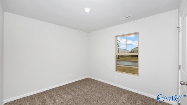 view of carpeted spare room