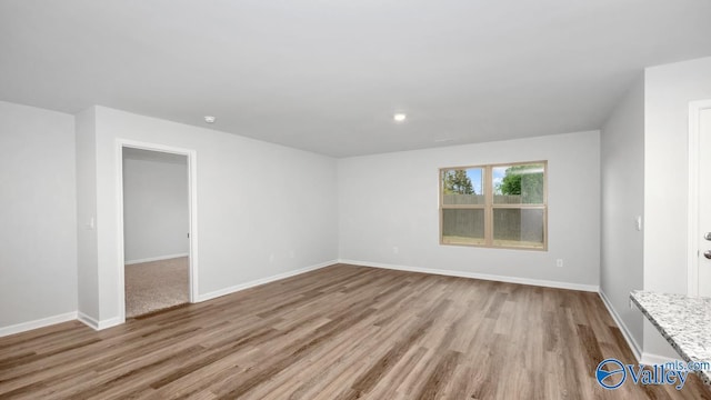 unfurnished room featuring light wood-type flooring