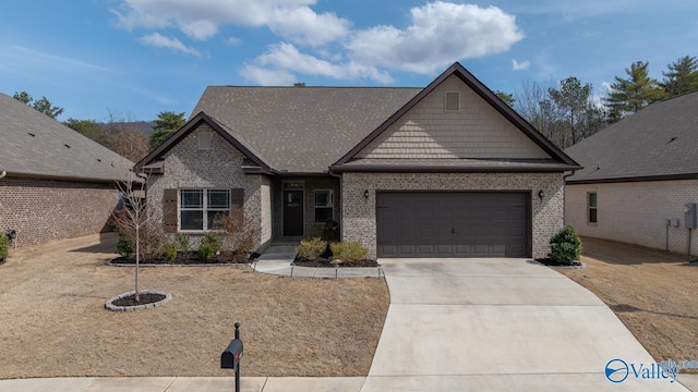 craftsman-style house featuring concrete driveway, brick siding, and an attached garage