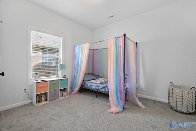 bedroom featuring carpet flooring, visible vents, and baseboards