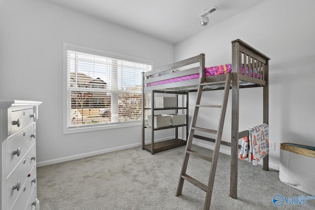 carpeted bedroom with visible vents and baseboards