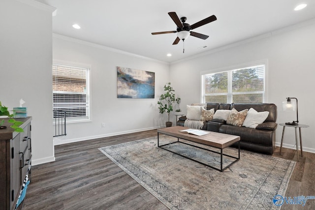 living area featuring crown molding, dark wood finished floors, and baseboards