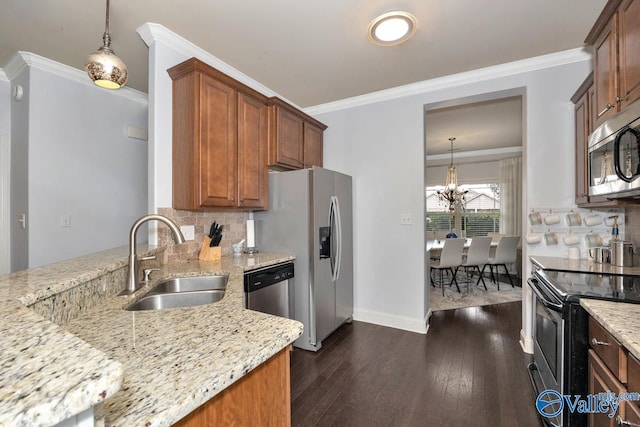 2906 Pasture View Ln, Owens Cross Roads, AL 35763 - kitchen featuring stainless steel appliances, light stone countertops, decorative backsplash, a chandelier, and ornamental molding
