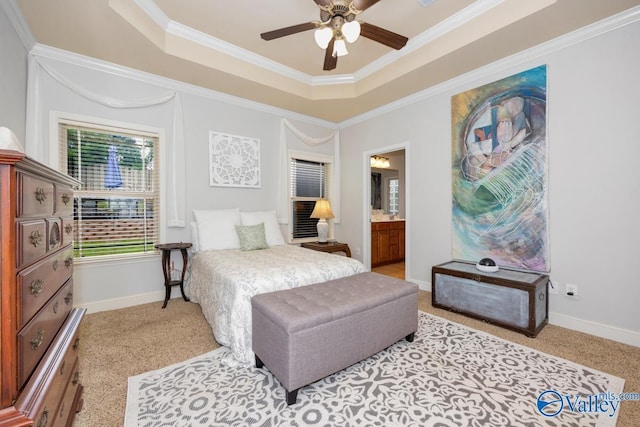 2906 Pasture View Ln, Owens Cross Roads, AL 35763 - carpeted bedroom featuring a tray ceiling, ornamental molding, ensuite bathroom, and ceiling fan