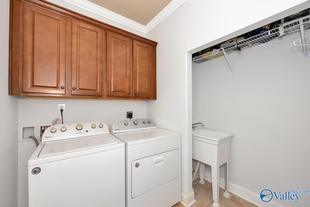 2906 Pasture View Ln, Owens Cross Roads, AL 35763 - laundry area with washer and dryer, cabinet space, and ornamental molding