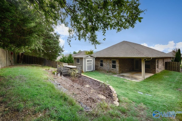 2906 Pasture View Ln, Owens Cross Roads, AL 35763 - fenced backyard featuring a storage shed and a patio area