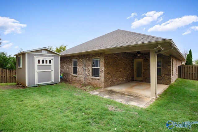 2906 Pasture View Ln, Owens Cross Roads, AL 35763 - back of property featuring a patio area, a shingled roof, a storage shed, and brick siding