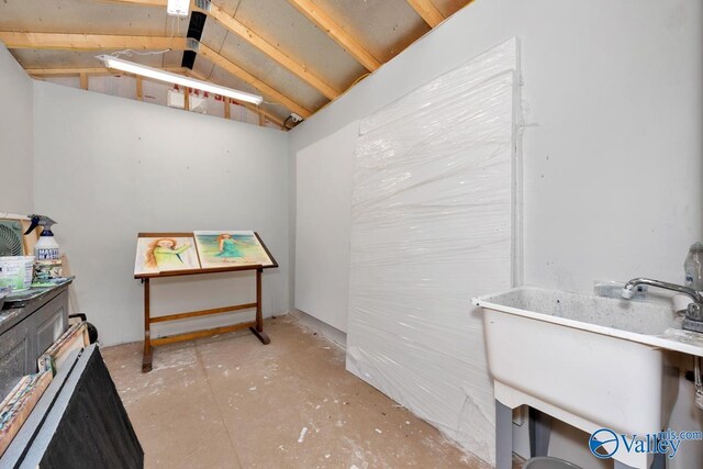 2906 Pasture View Ln, Owens Cross Roads, AL 35763 - misc room featuring lofted ceiling and unfinished concrete flooring