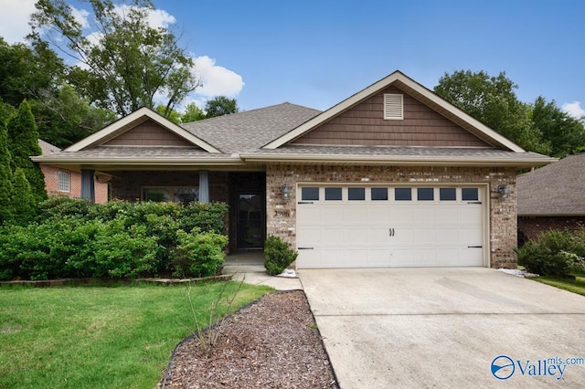 2906 Pasture View Ln, Owens Cross Roads, AL 35763 - view of front of house with brick siding, a garage, concrete driveway, and roof with shingles