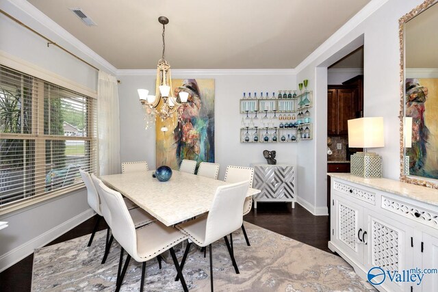 2906 Pasture View Ln, Owens Cross Roads, AL 35763 - dining room featuring a chandelier, dark wood-type flooring, and ornamental molding