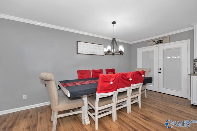 12956 Hickory Hills Rd, Athens, AL 35614 - dining space featuring hardwood / wood-style flooring, french doors, crown molding, and an inviting chandelier