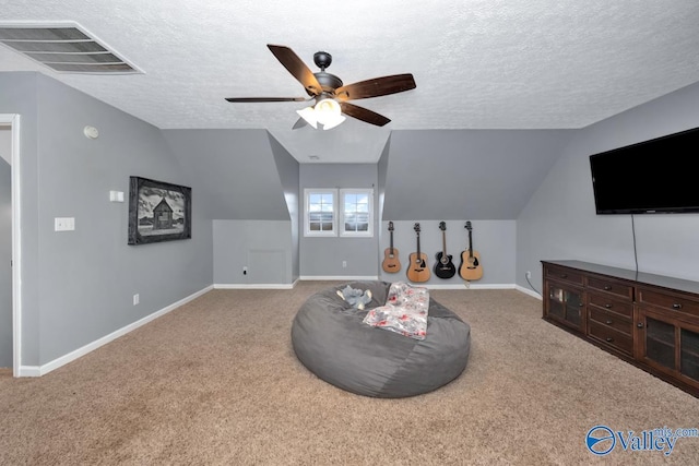 12956 Hickory Hills Rd, Athens, AL 35614 - living area with carpet, ceiling fan, a textured ceiling, and vaulted ceiling