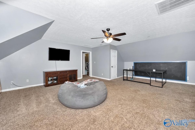 12956 Hickory Hills Rd, Athens, AL 35614 - living room featuring vaulted ceiling, ceiling fan, carpet, and a textured ceiling