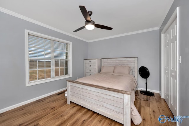 12956 Hickory Hills Rd, Athens, AL 35614 - bedroom with wood-type flooring, a closet, ceiling fan, and crown molding