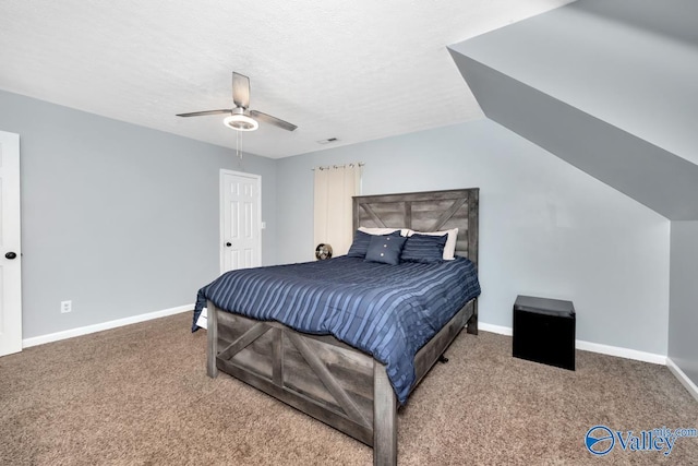12956 Hickory Hills Rd, Athens, AL 35614 - carpeted bedroom with a textured ceiling, vaulted ceiling, and ceiling fan