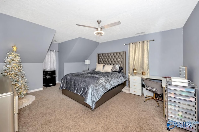 12956 Hickory Hills Rd, Athens, AL 35614 - bedroom featuring a textured ceiling, light colored carpet, vaulted ceiling, and ceiling fan