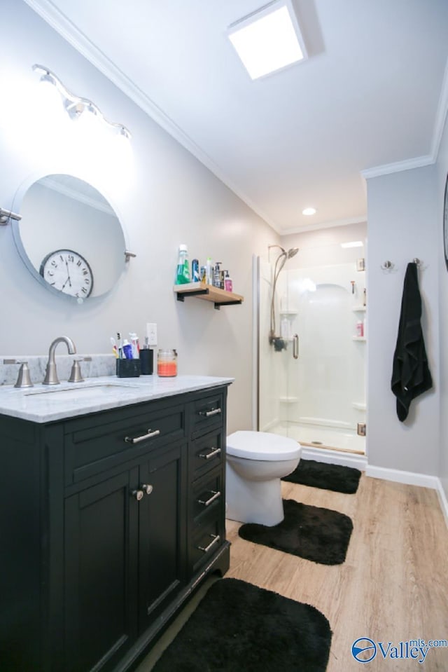 bathroom with toilet, an enclosed shower, crown molding, vanity, and hardwood / wood-style floors