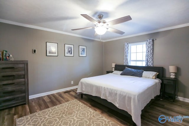 bedroom with crown molding, ceiling fan, and dark hardwood / wood-style flooring