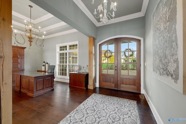 entrance foyer with french doors, crown molding, and dark hardwood / wood-style floors