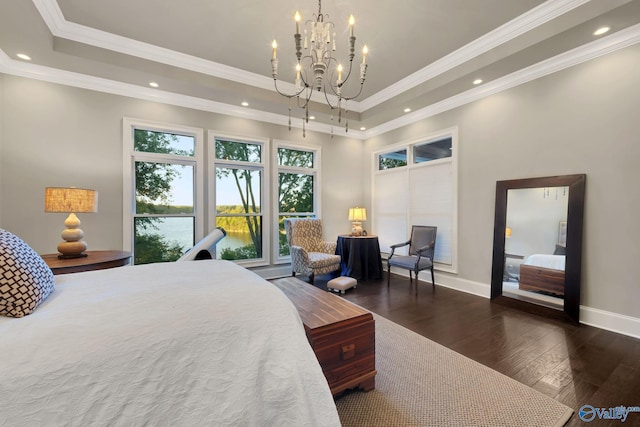 bedroom with an inviting chandelier, crown molding, dark wood-type flooring, and a raised ceiling