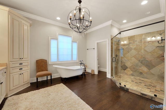 bathroom featuring vanity, separate shower and tub, ornamental molding, and wood-type flooring