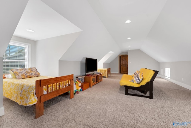 bedroom featuring vaulted ceiling and carpet floors