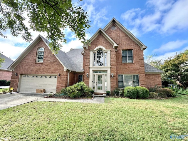 1509 Southampton Ct, Decatur, AL 35601 - traditional-style home featuring brick siding, concrete driveway, a garage, a front yard, and a shingled roof