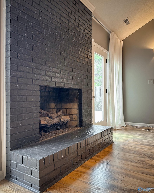 1509 Southampton Ct, Decatur, AL 35601 - detailed view of a fireplace, wood finished floors, baseboards, and ornamental molding