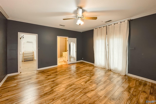 1509 Southampton Ct, Decatur, AL 35601 - unfurnished bedroom with baseboards, crown molding, light wood finished floors, connected bathroom, and a ceiling fan