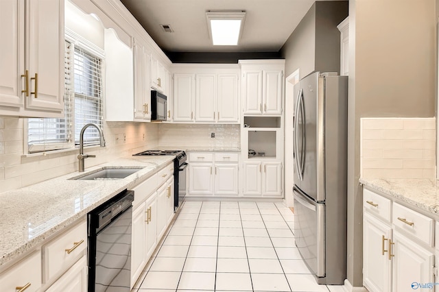 1509 Southampton Ct, Decatur, AL 35601 - kitchen featuring black appliances, a sink, and white cabinetry