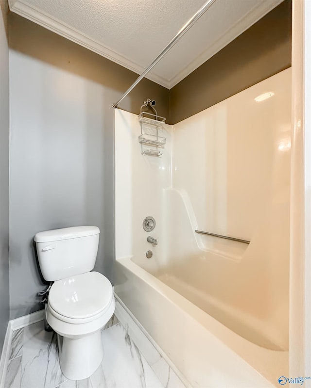 1509 Southampton Ct, Decatur, AL 35601 - bathroom featuring toilet, marble look tiles, a textured ceiling, washtub / shower combination, and baseboards
