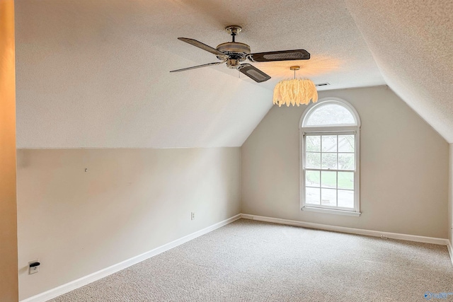 1509 Southampton Ct, Decatur, AL 35601 - additional living space with a textured ceiling, ceiling fan, carpet, vaulted ceiling, and baseboards