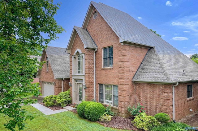 1509 Southampton Ct, Decatur, AL 35601 - view of front of property with a shingled roof, brick siding, and a front yard