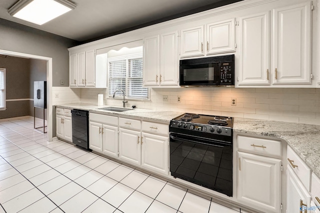 1509 Southampton Ct, Decatur, AL 35601 - kitchen with black appliances, a sink, white cabinets, decorative backsplash, and light tile patterned flooring
