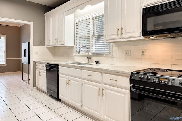1509 Southampton Ct, Decatur, AL 35601 - kitchen with black appliances, a sink, white cabinets, decorative backsplash, and light tile patterned floors