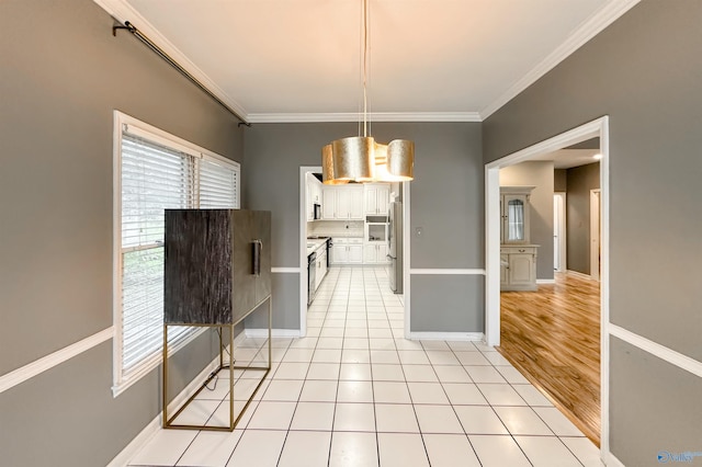 1509 Southampton Ct, Decatur, AL 35601 - unfurnished dining area featuring healthy amount of natural light, ornamental molding, baseboards, and light tile patterned flooring