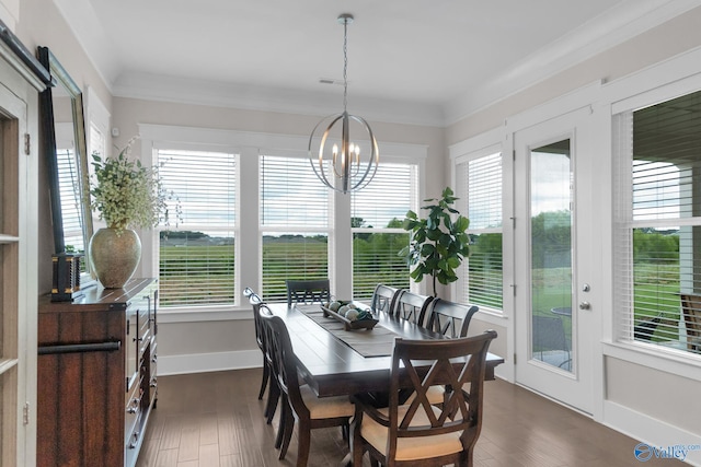 241 Farmhouse Dr, Madison, AL 35757 - dining room featuring a chandelier, dark wood-type flooring, baseboards, and crown molding